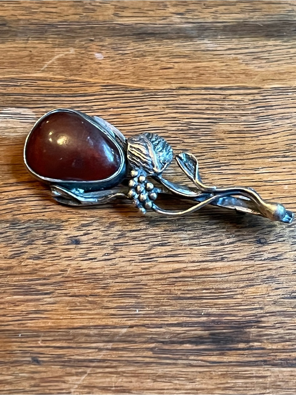 Handcrafted Sterling Silver Flower Brooch with Deep Red Amber Cabochon Stone